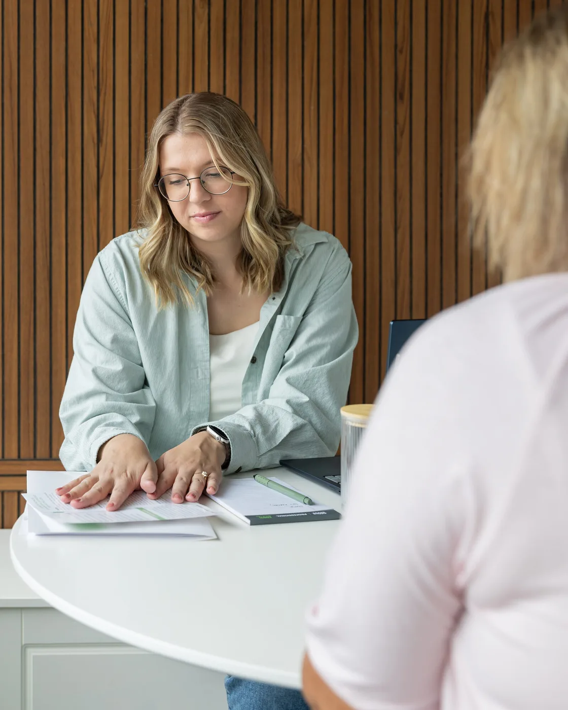 A patient and Dr. Abbie talking through a symptom history during a consultation